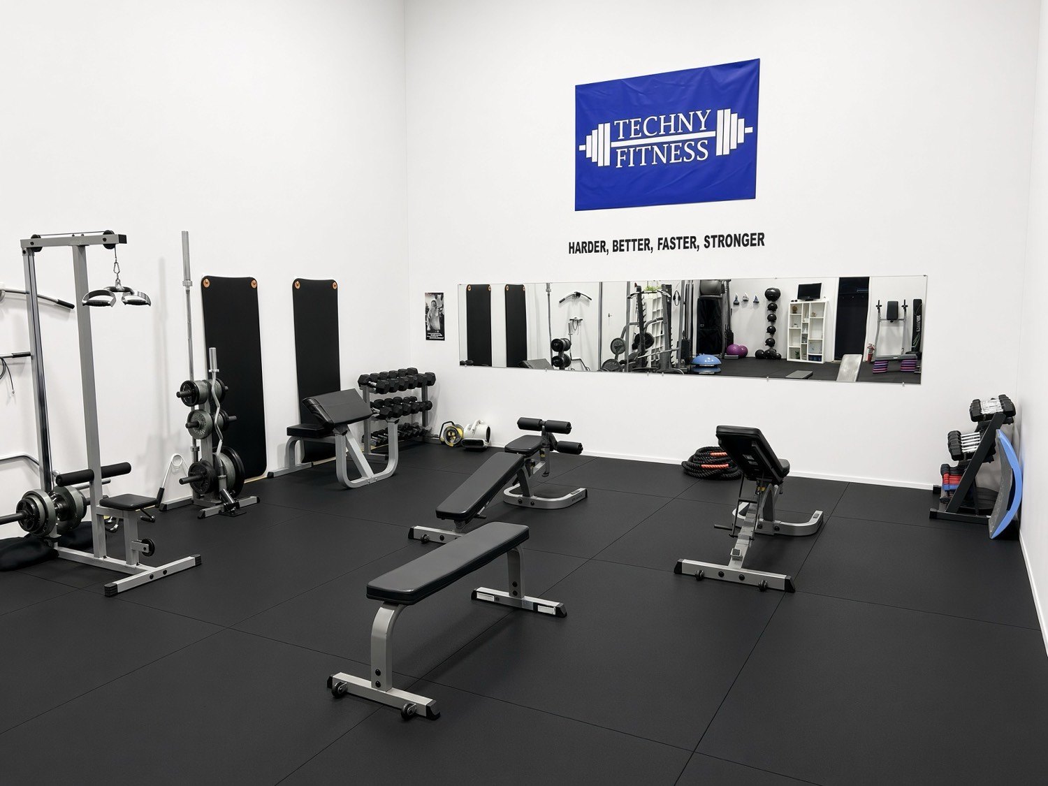 Benches and the Techny Fitness banner inside the studio